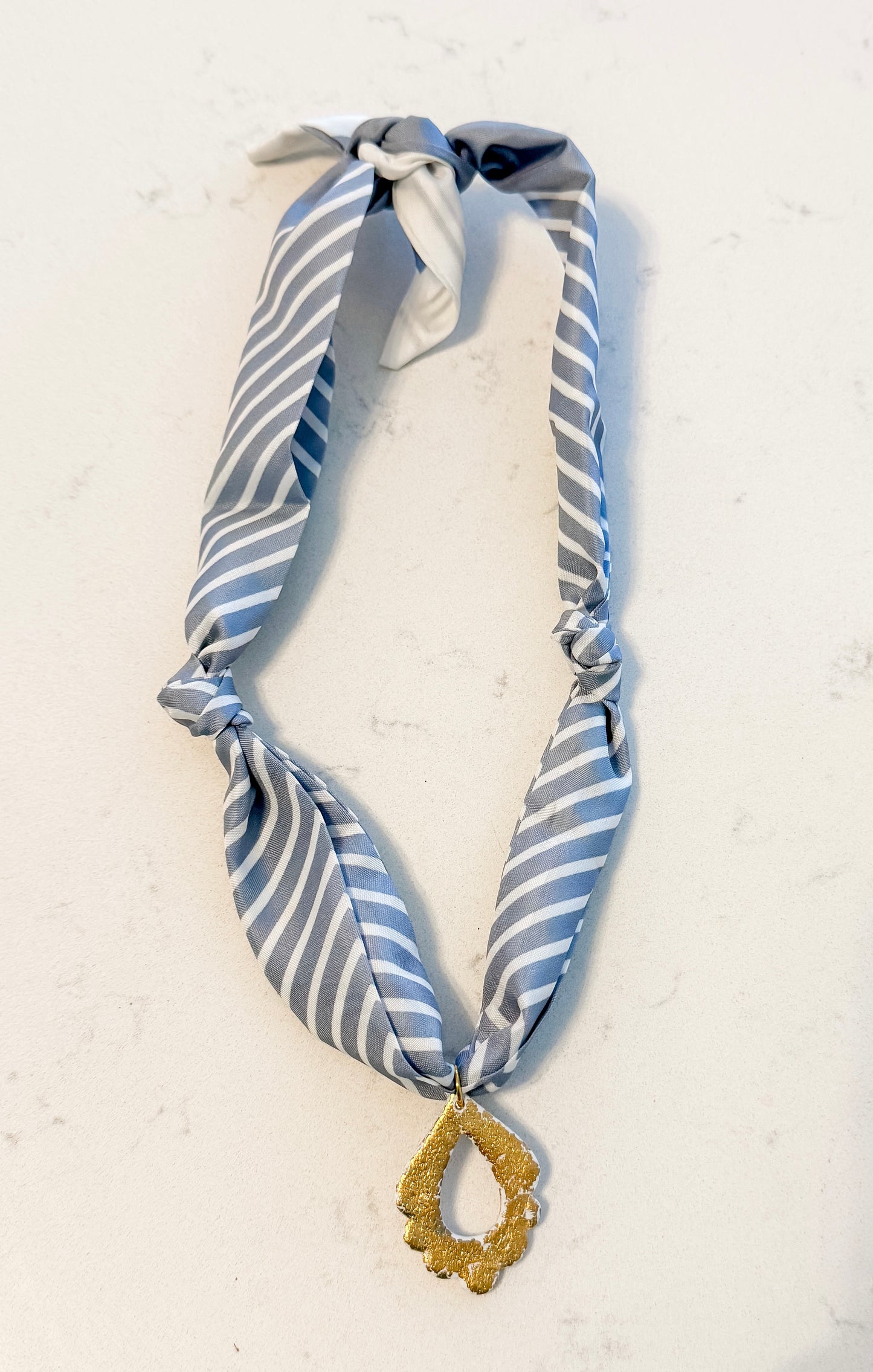 Steel blue stripe w gold charm